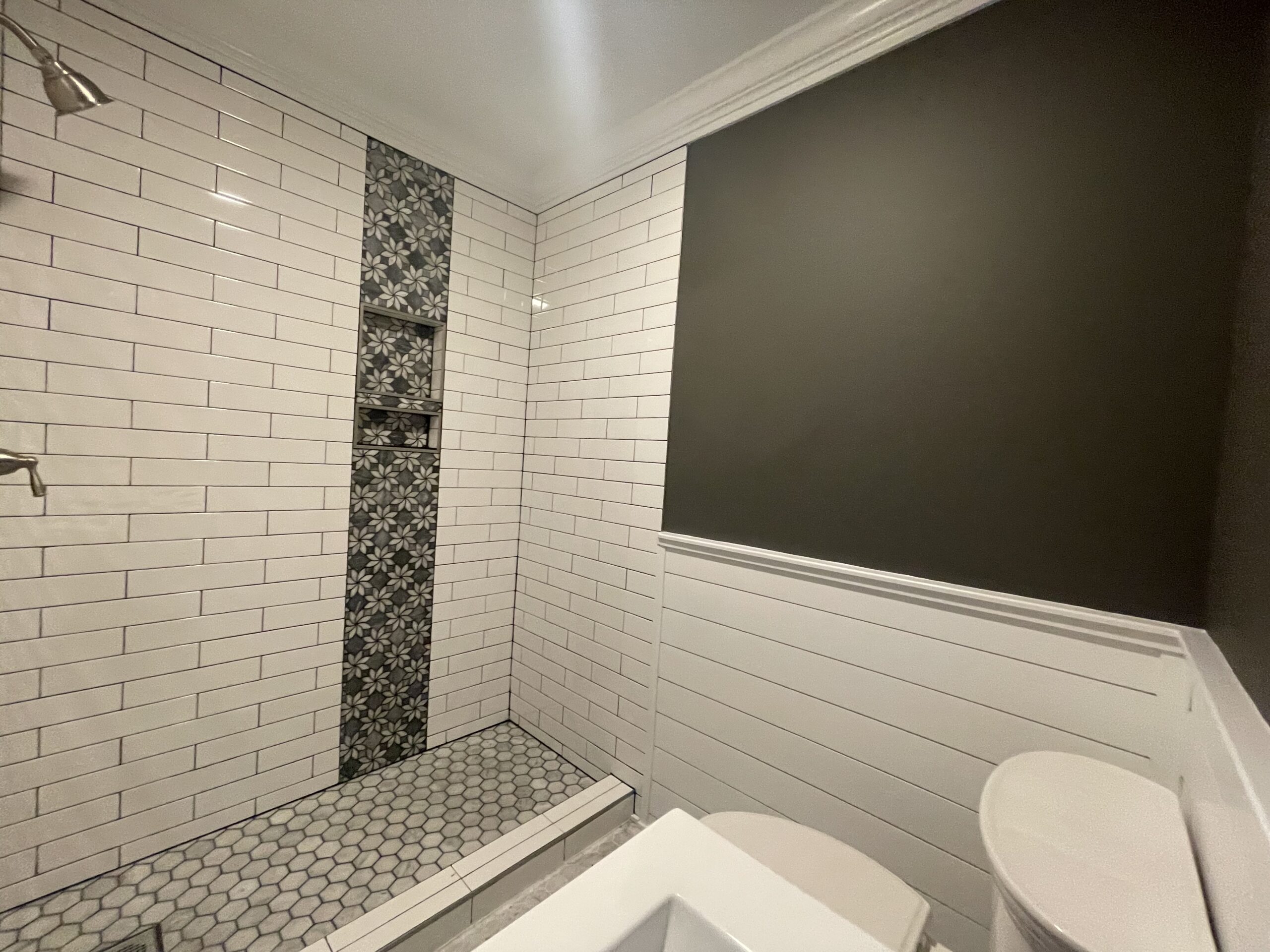 stunning tile work in bathroom remodel